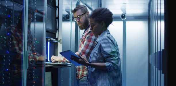 diverse it colleagues setting server hardware