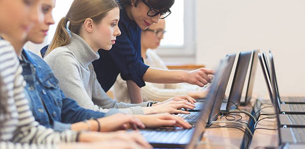 female students learning computer programming 1