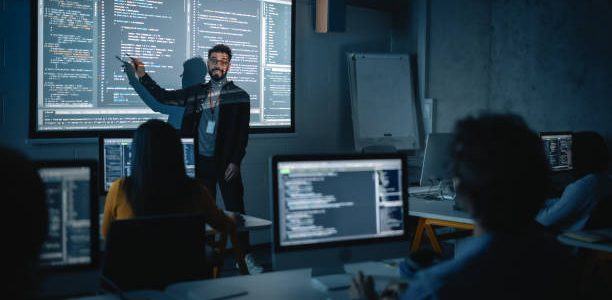 teacher giving computer science lecture to diverse multiethnic group of female and male 1